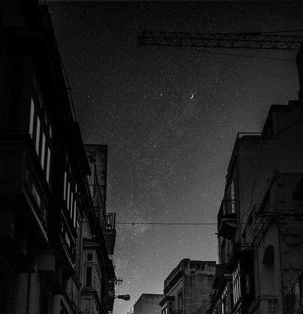 Stock image of a city sky at night in black and white