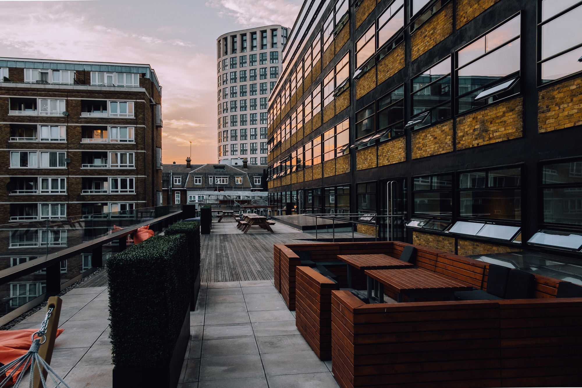 Stock image of an outdoor patio on a building in a city.